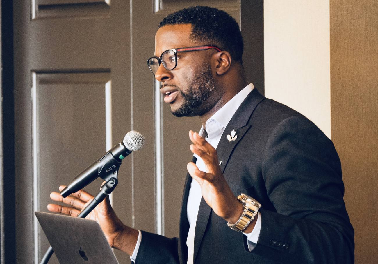 Dr. Jackson delivering a keynote at the microphone